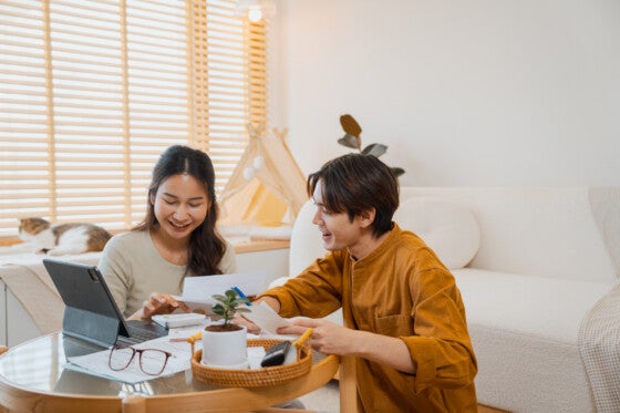 Couple doing home finances together at a table