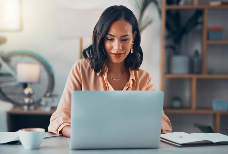 woman on computer happy