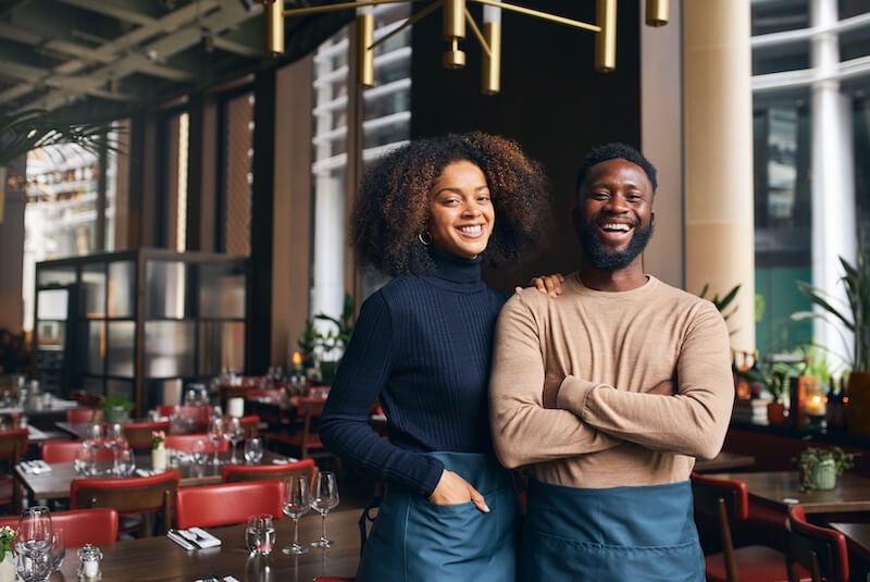 happy business owner couple happy with their savings