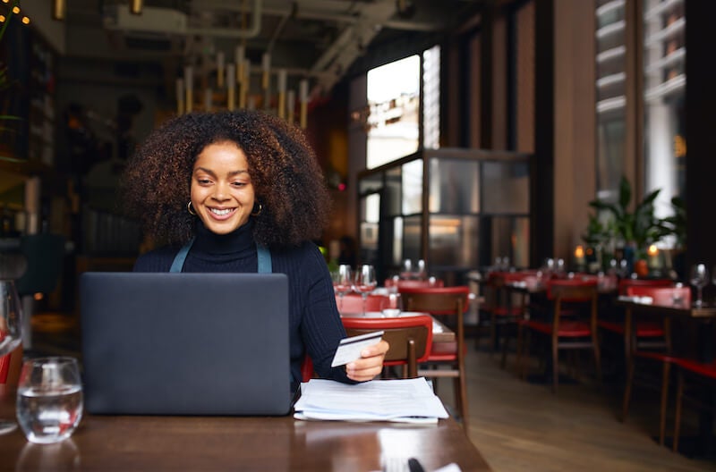 business owner using debit card