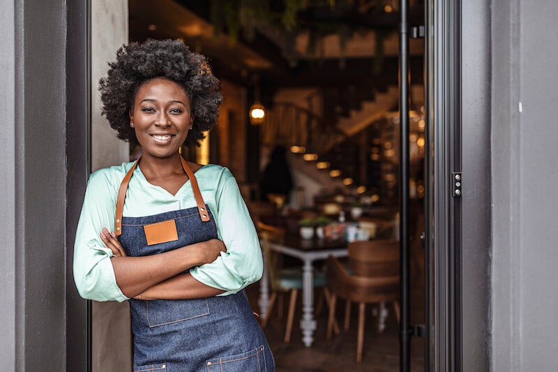 business owner in front of her store