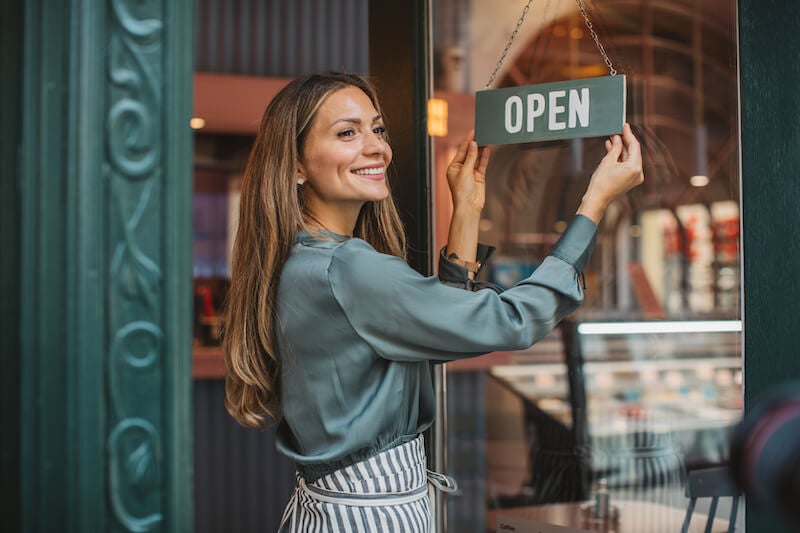 happy woman business owner opening new business bank account