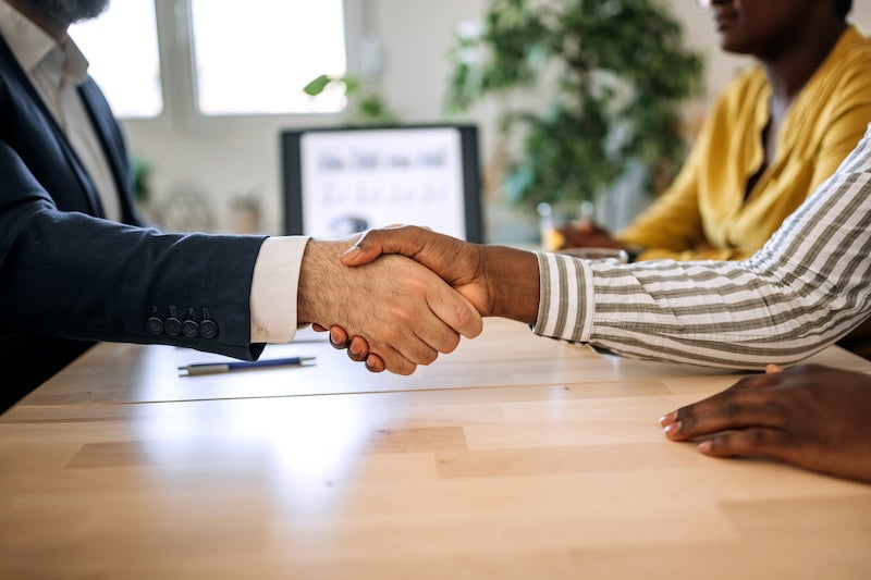 shaking hands at mortgage closing