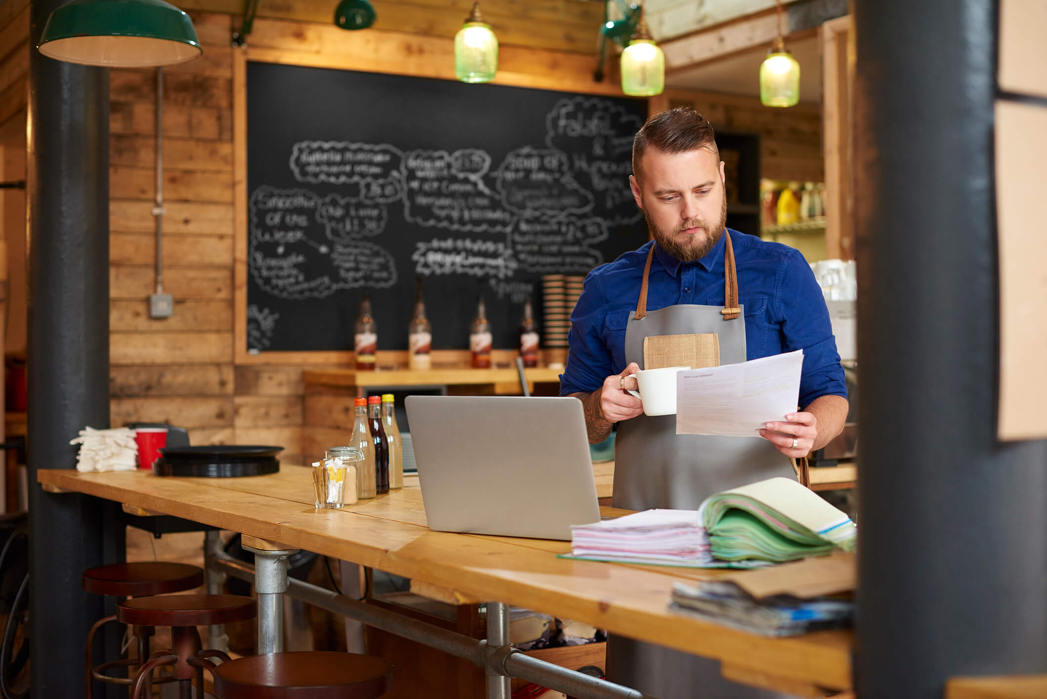 cafe owner looking at his business credit report