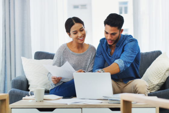 Couple looking up information about underwriter fees.