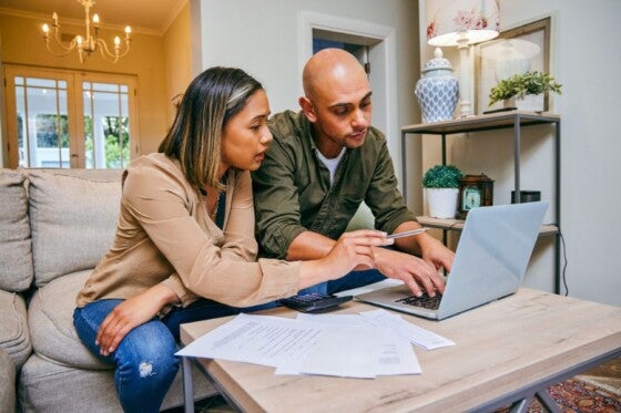 Couple looking into a home equity loan vs second mortgage.