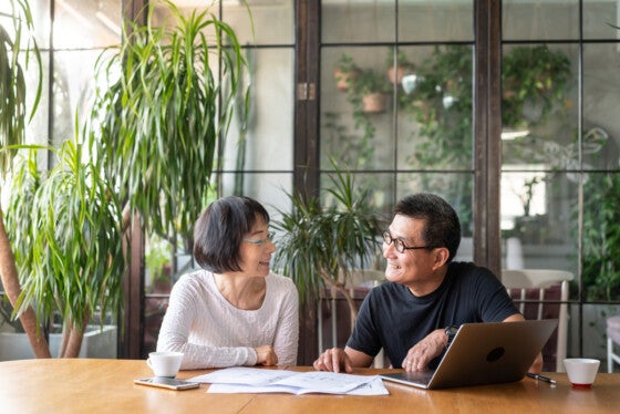 Asian couple talking about land loans in Tennessee.