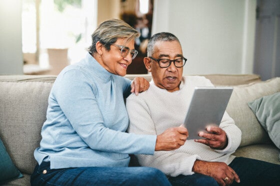 Shot of a senior couple looking up pros and cons of retiring in Tennessee.