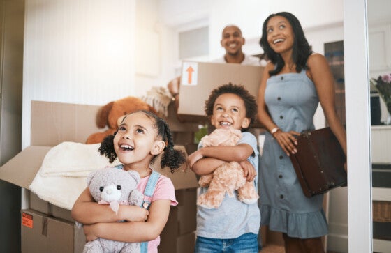 Happy family moving into their new home