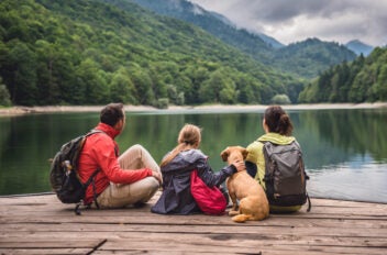 family enjoying their savings at the lake from a cd