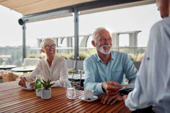 senior man using contactless payment with southeast bank debit card