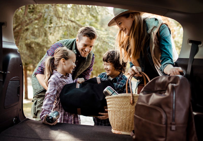 Family packing car for vacation