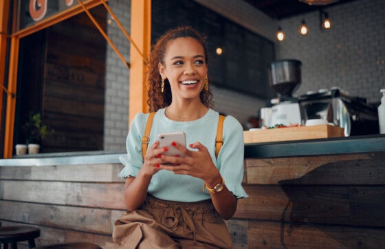 woman on phone receiving direct deposit with southeast bank