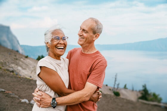 Joyful retired couple hiking