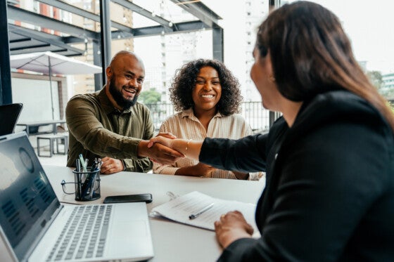 Couple closing contract with agent