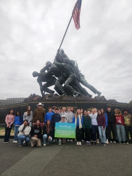 Dayton City Students Holding SouthEast Bank Sign at Washington D.C. Memorial